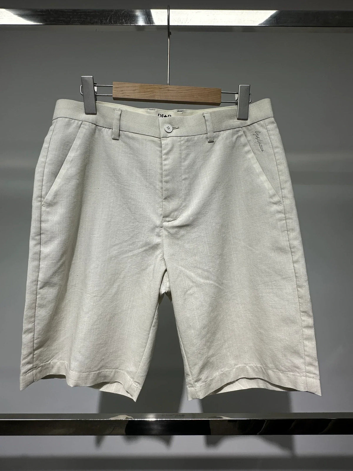 Ivory pleated shorts — Original front photograph — Ivory pleated shorts