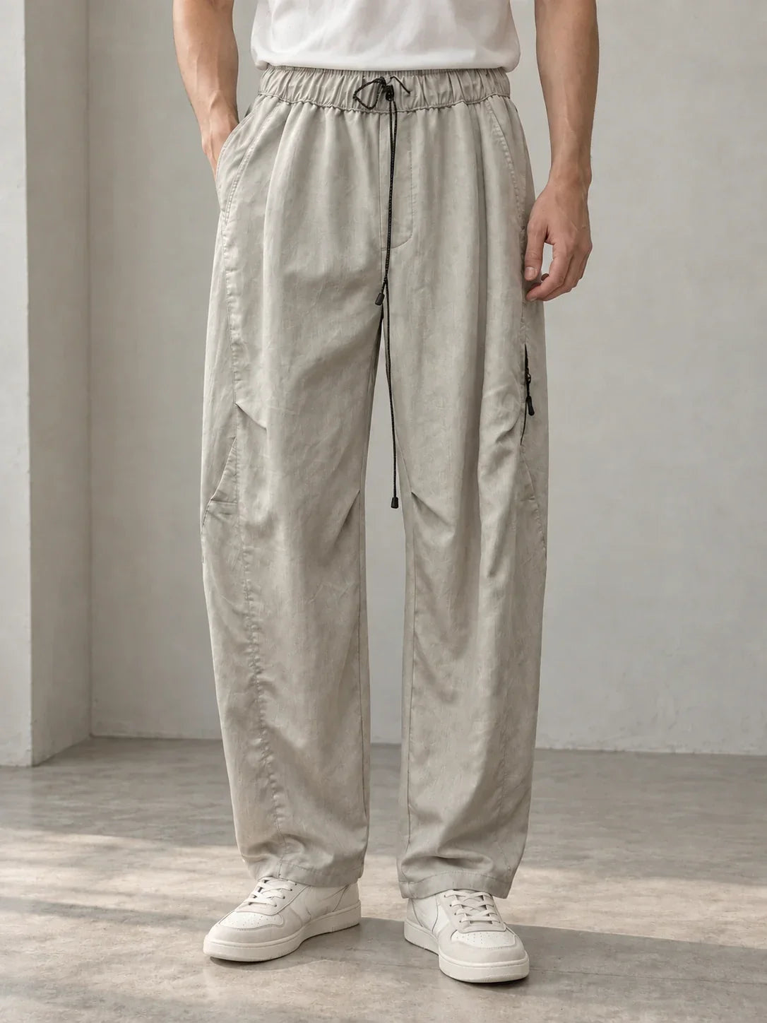 Stone drawcord trousers — AI-generated model styling