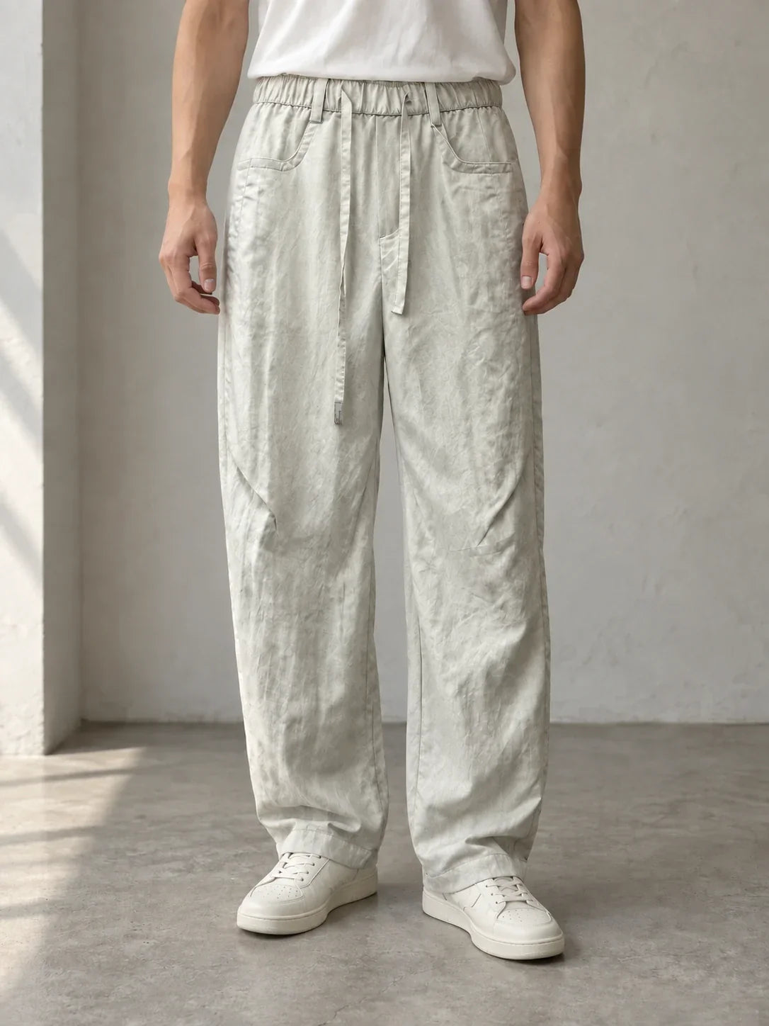 Stone tie-waist trousers — AI-generated model styling