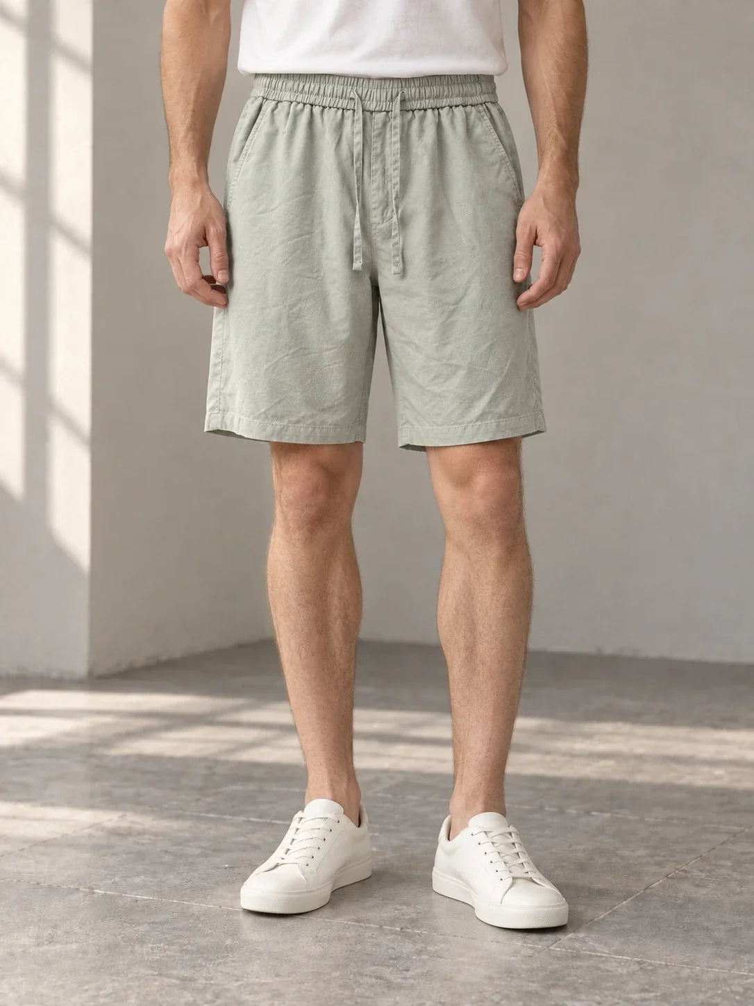 Sage drawcord shorts — AI-generated model styling